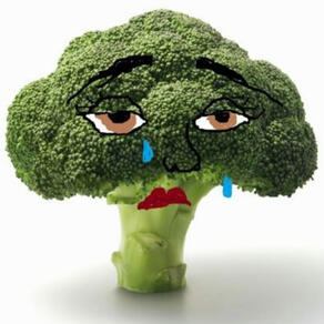 Picture of a head of broccoli with eyes and lips in a morose expression, with one shed tear, drawn on in ms paint.